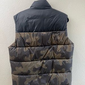 I have a brand new HUGO BOSS vest with tags that never warn No stains or damage